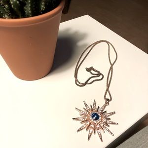 Blue sapphire starburst pendant necklace